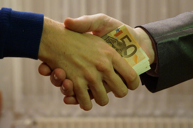 Handshake with money